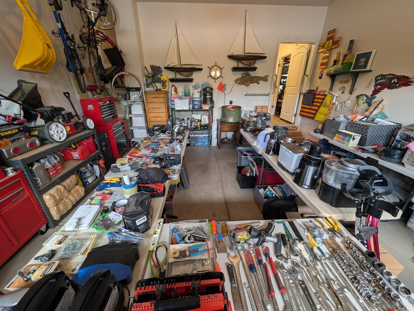 Packed garage of estate-sale inventory before cataloging